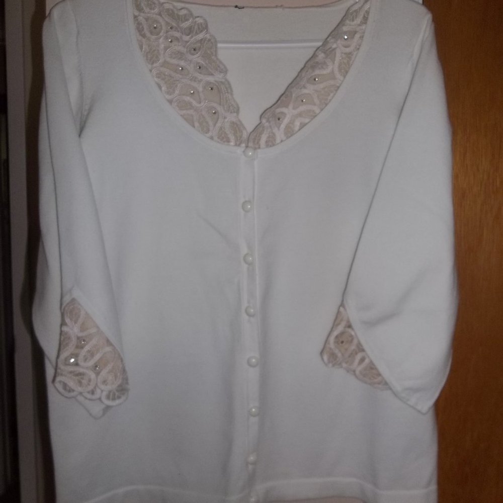 White sweater with cream lace accents